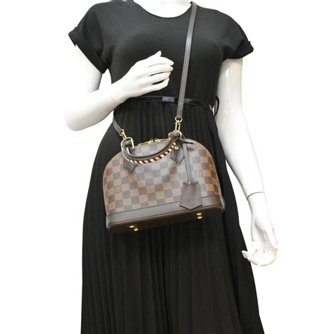 louis vuitton alma bb damier ebene canvas|louis vuitton braided handle handbag.